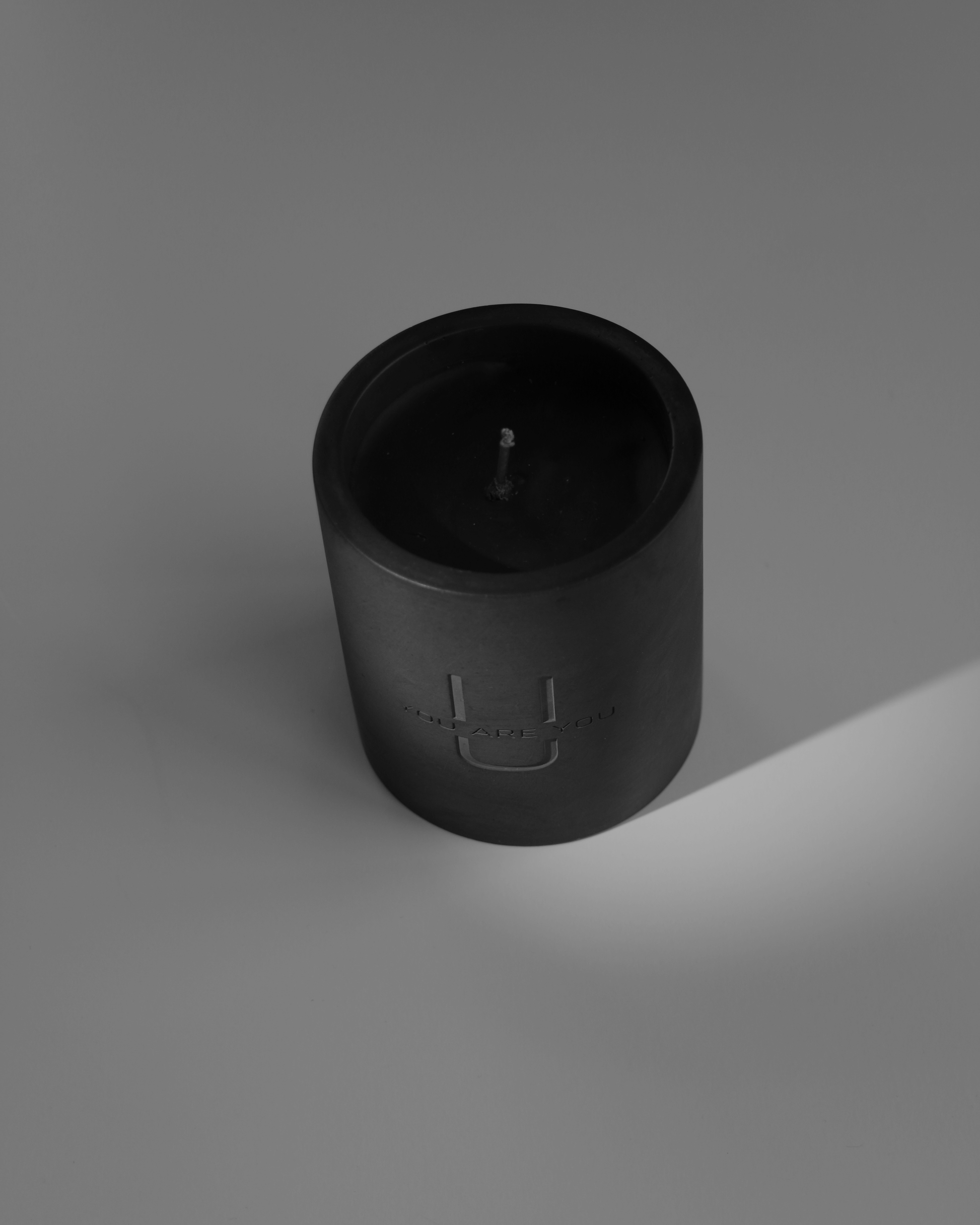 Handcrafted luxury black candle in a cement jar 